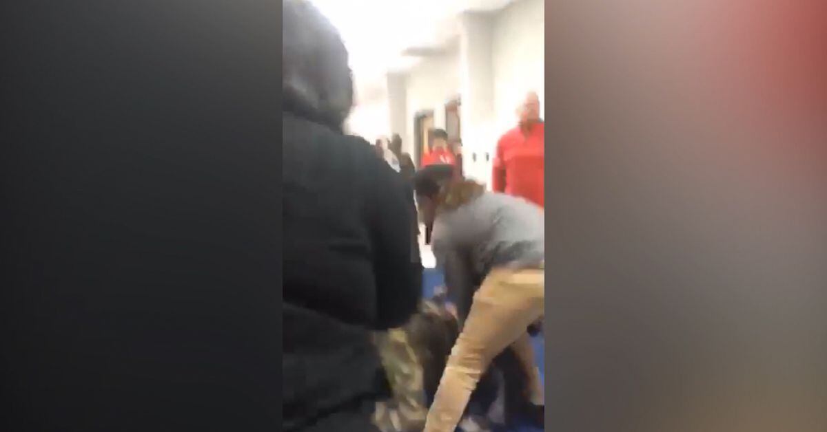 Teacher caught on video yelling racial slur while trying to stop fight ...