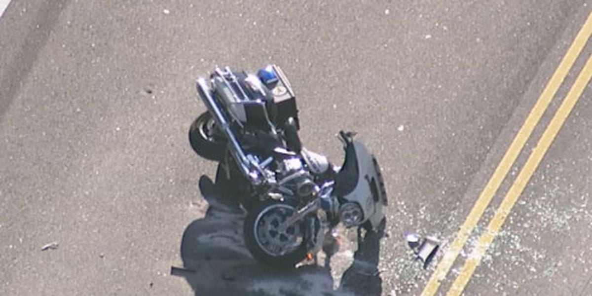 Motorcycle officer taken to hospital after crash in Belmont